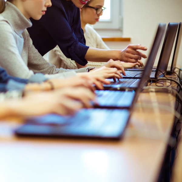 female students working on notebook computers